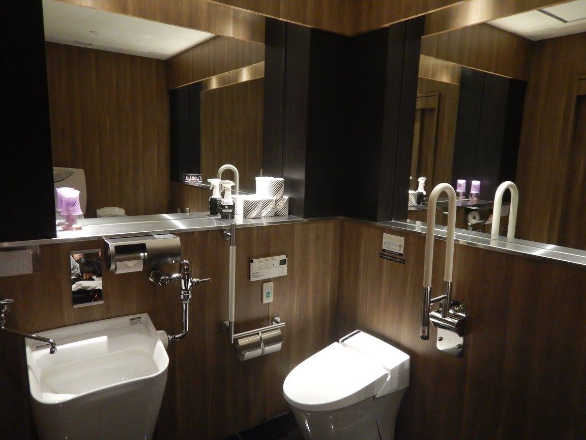 nice big accessible bathroom next to restaurant floor